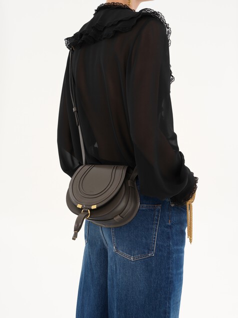 Small Marcie saddle bag in shiny leather