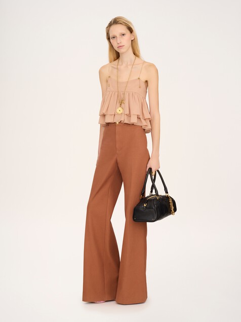 Sleeveless ruffled top in silk georgette