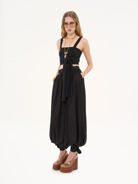 Fluid pleated trousers in silk charmeuse